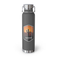 Grey stainless steel water bottle featuring a design of Saguaro National Park with cactus and sunset scenery.