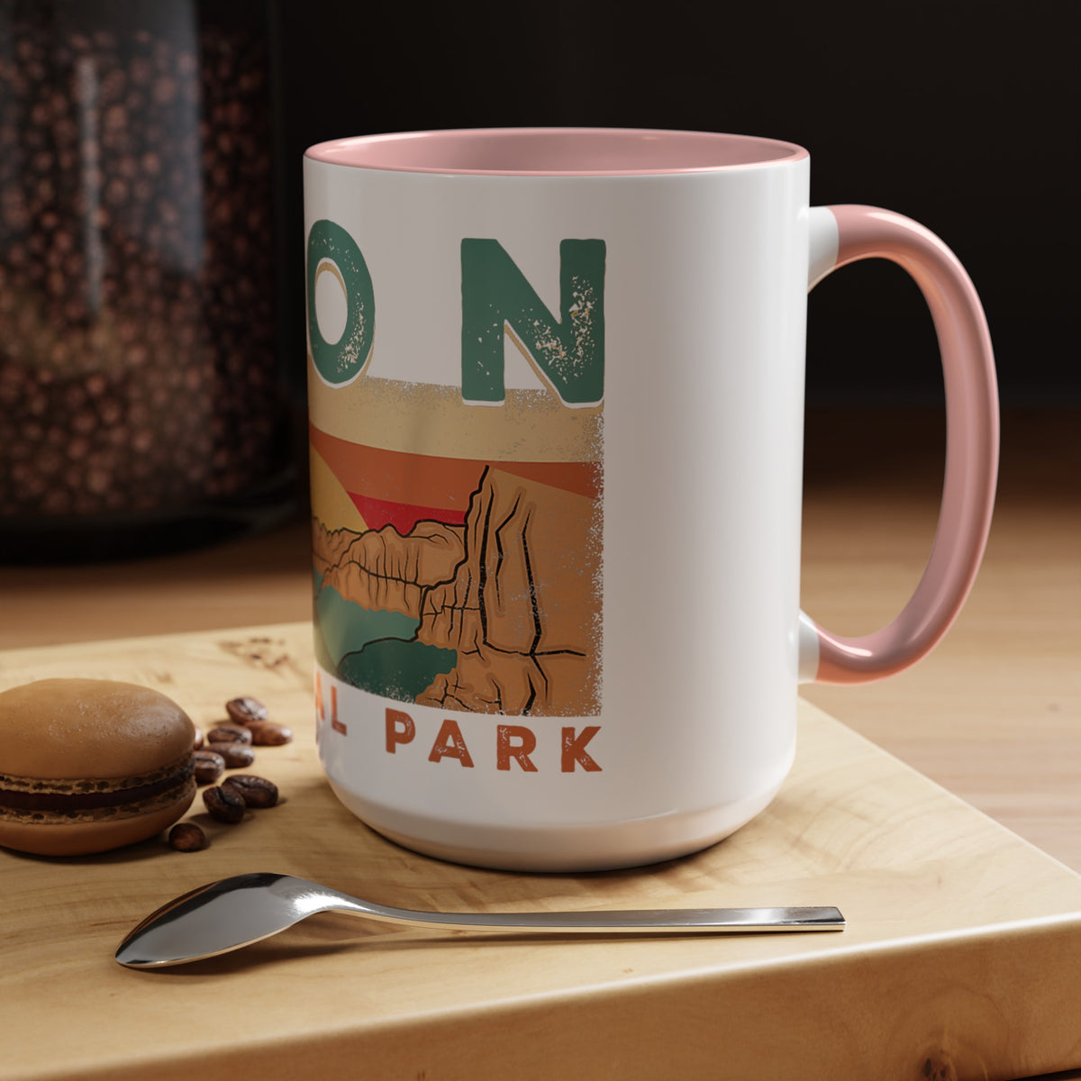 White ceramic mug with contrasting handle and interior, featuring a sunset landscape design of Zion National Park.