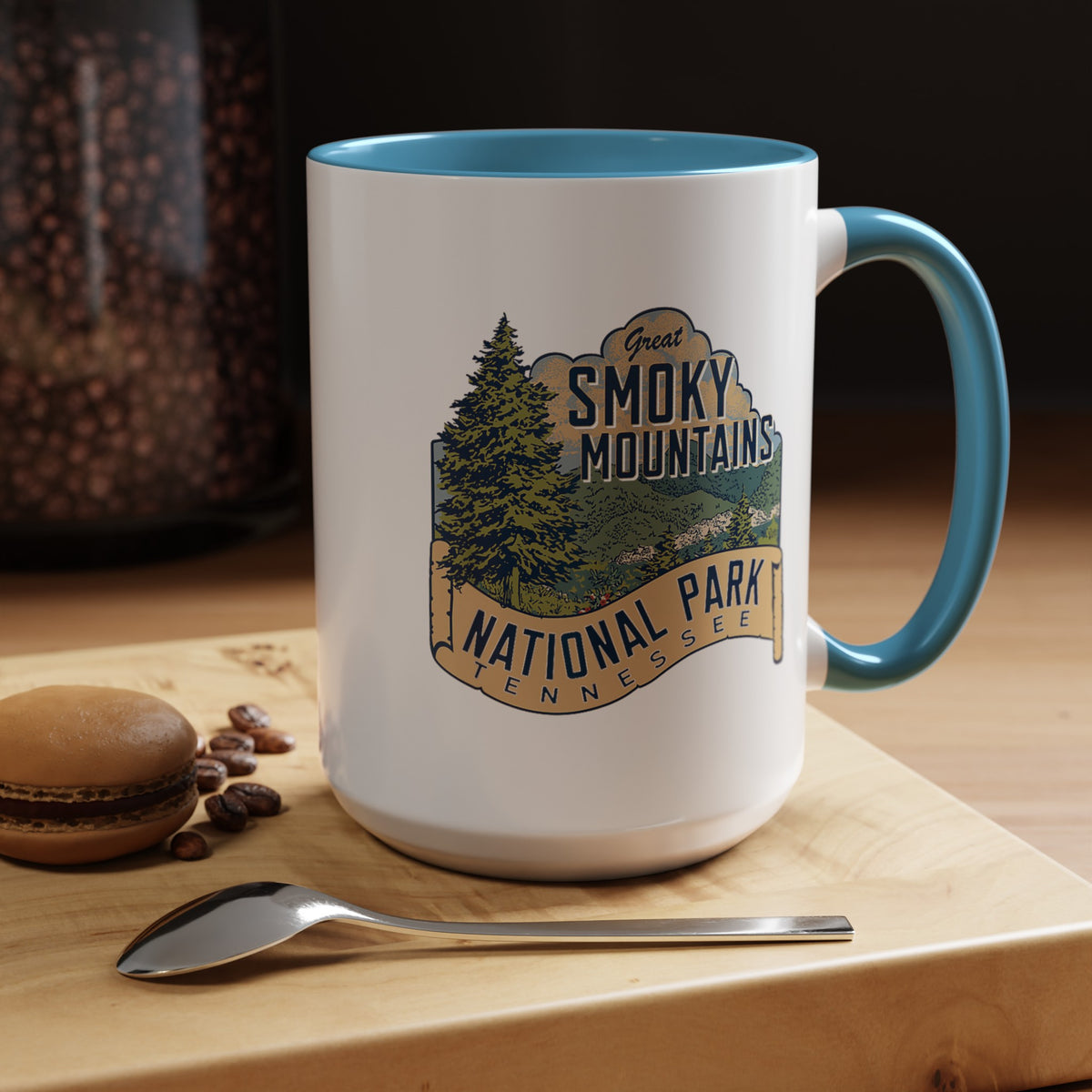 15 oz light blue ceramic mug featuring an illustration of Great Smoky Mountains National Park with a scenic view and trees, labeled Tennessee.