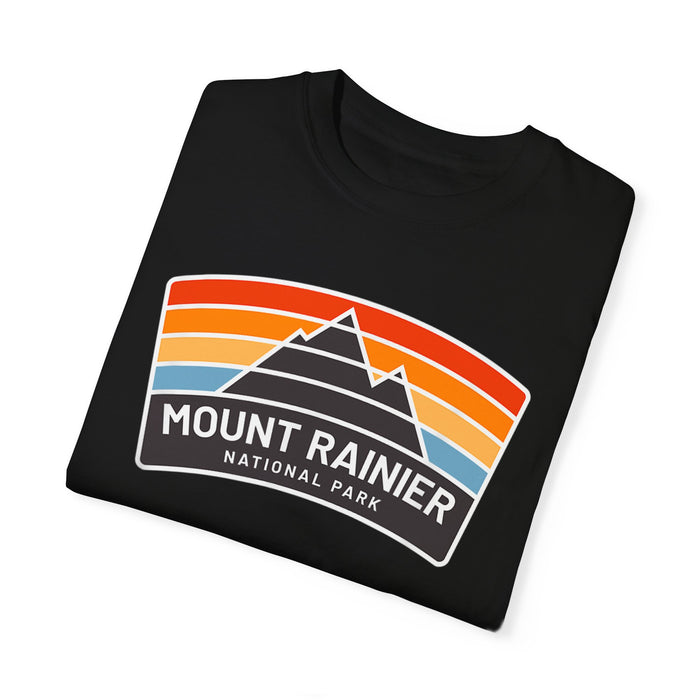 T-shirt featuring a vintage design with "Mount Rainier National Park" text and colorful stripes.