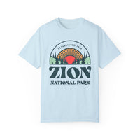 T-shirt featuring a scenic design with the text "Zion National Park" and a sunset graphic.