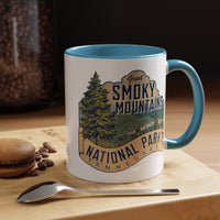 11 oz light blue ceramic mug featuring an illustration of Great Smoky Mountains National Park with a scenic view and trees, labeled Tennessee.