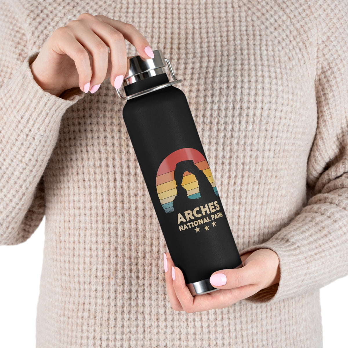 Image of a stainless steel water bottle featuring a design from Arches National Park.