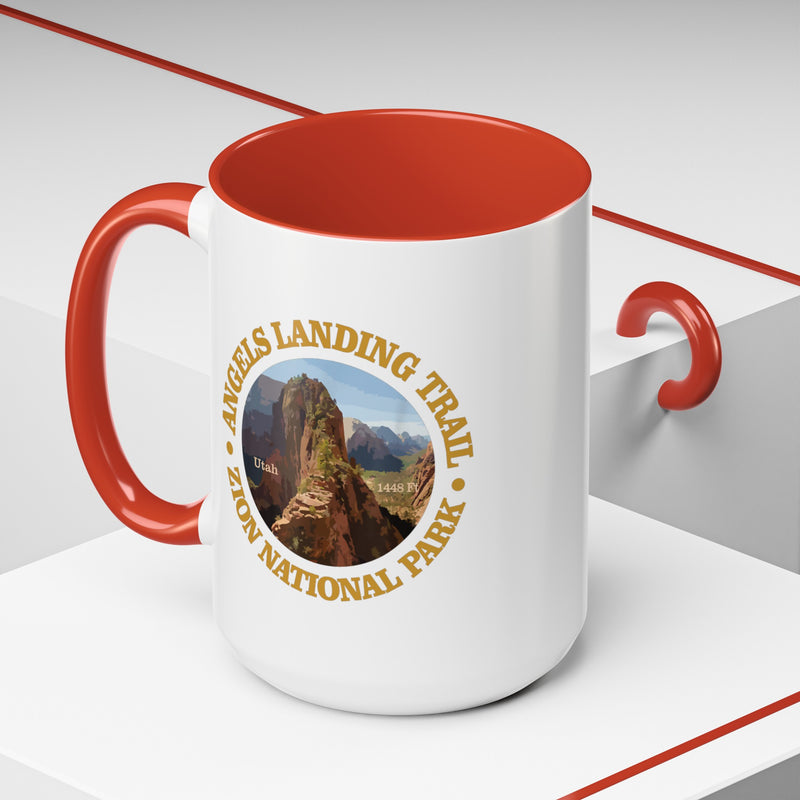 White ceramic mug with a contrasting handle and interior, featuring an image of Angels Landing Trail in Zion National Park with a mountain landscape design.