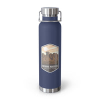 Navy stainless steel water bottle featuring a design of Theodore Roosevelt National Park with scenic rock formations.