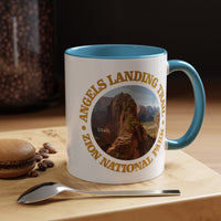 White ceramic mug with a contrasting handle and interior, featuring an image of Angels Landing Trail in Zion National Park with a mountain landscape design.