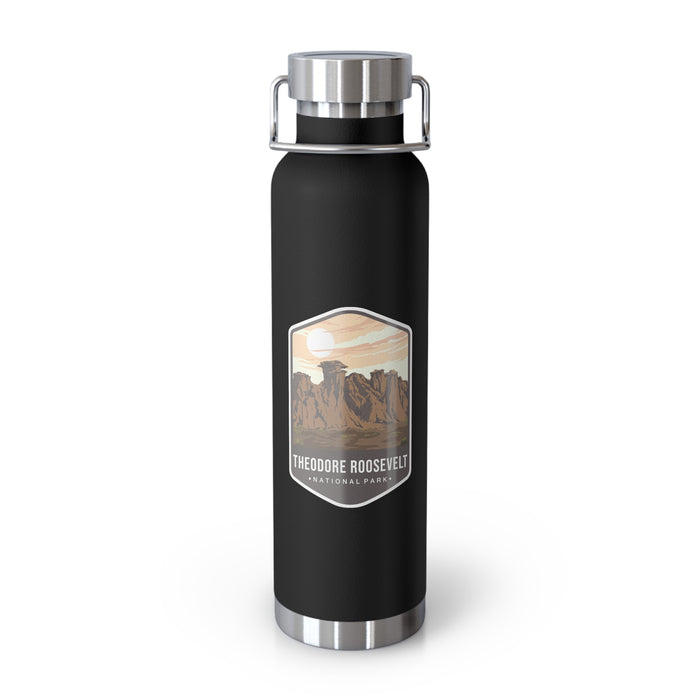 Black stainless steel water bottle featuring a design of Theodore Roosevelt National Park with scenic rock formations.