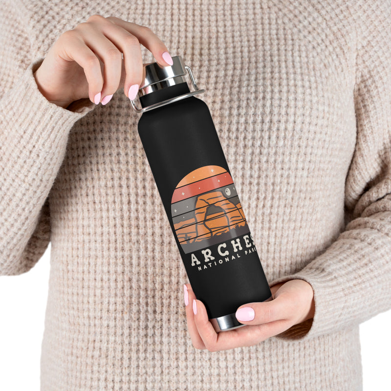 Image of a stainless steel water bottle featuring a design from Arches National Park in Utah.