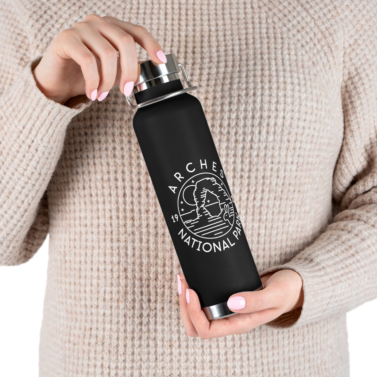 Image of a stainless steel water bottle featuring a design from Arches National Park.