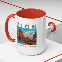 White ceramic mug with a contrasting handle and interior, featuring a scenic landscape design of Zion National Park.