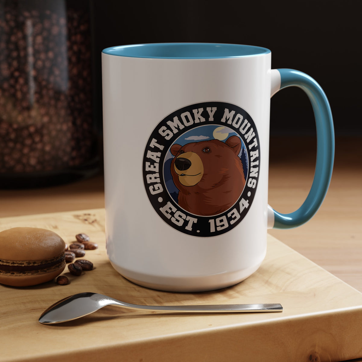 15 oz light blue ceramic mug featuring an illustration of a bear with the text "Great Smoky Mountains Est. 1934."