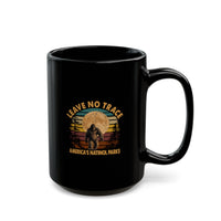 Bigfoot souvenir mug with "Leave No Trace" text and America's National Parks scene in the background.