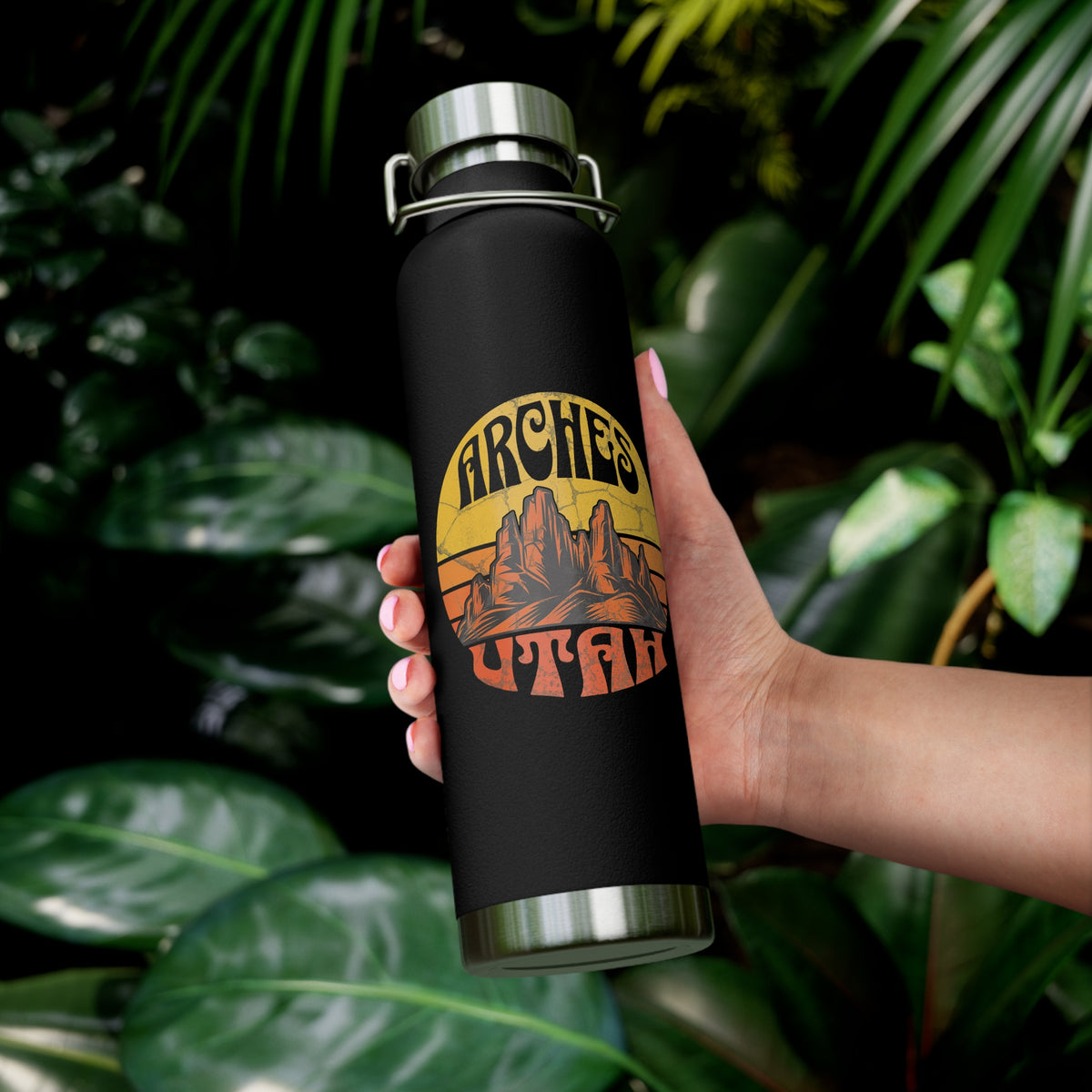 Image of a stainless steel water bottle featuring a design from Arches National Park in Utah.