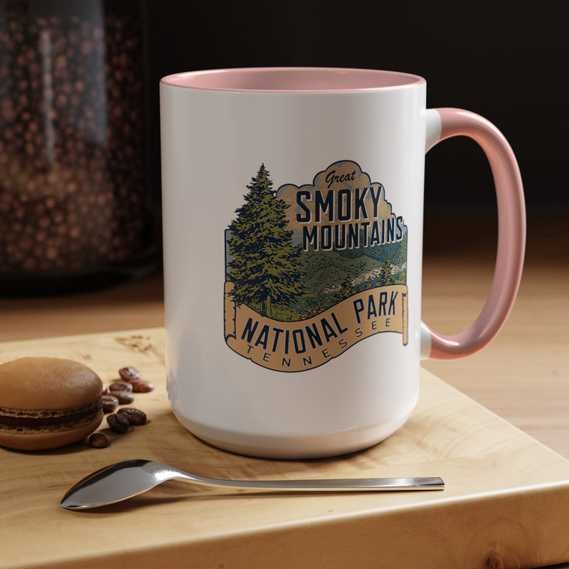 15 oz pink ceramic mug featuring an illustration of Great Smoky Mountains National Park with a scenic view and trees, labeled Tennessee.