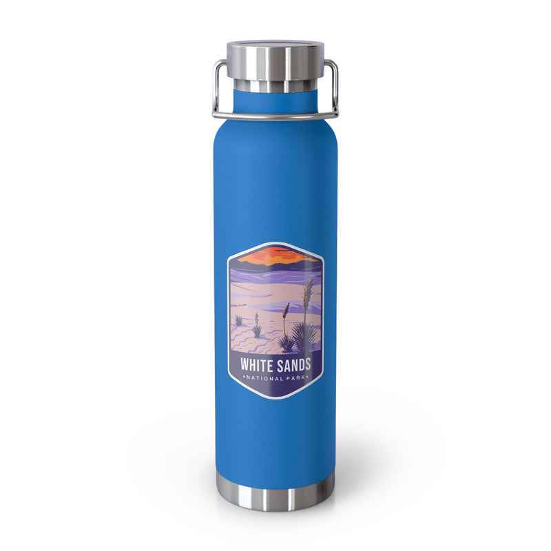 Pebble Blue stainless steel water bottle featuring a design of White Sands National Park with desert and sunset scenery.