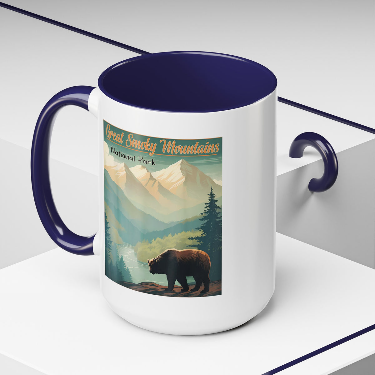 15 oz navy ceramic mug featuring an illustration of a bear in Great Smoky Mountains National Park with mountains and trees in the background.