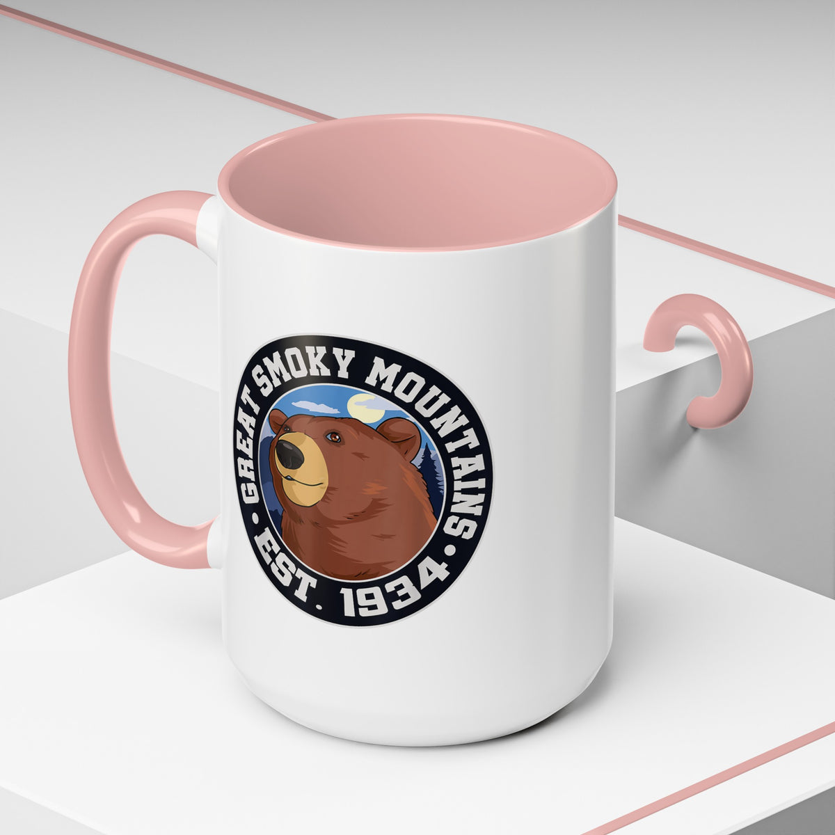 15 oz pink ceramic mug featuring an illustration of a bear with the text "Great Smoky Mountains Est. 1934."