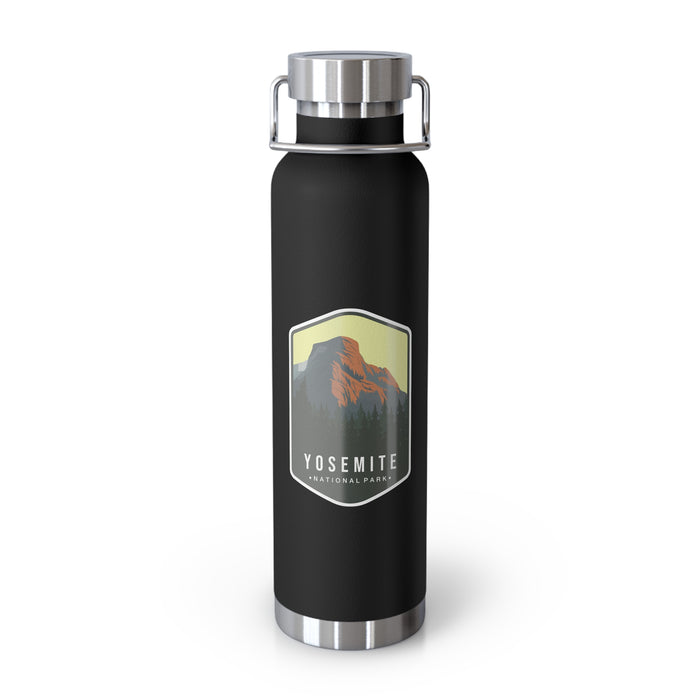 Black stainless steel water bottle featuring a design of Yosemite National Park with a mountain and forest scenery.