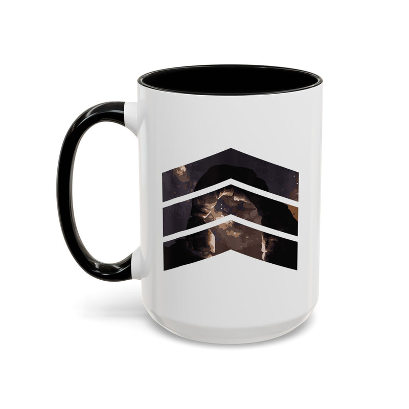 15 oz ceramic mug with black handle featuring a mountain design with three chevrons, representing Arches National Park.