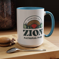 15 oz ceramic mug with light blue contrasting handle featuring an established 1919 design of Zion National Park, perfect as a souvenir.