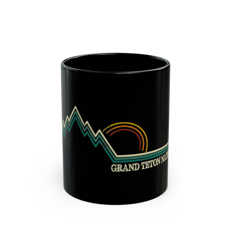 Grand Teton National Park souvenir mug featuring a mountain and sunset design.