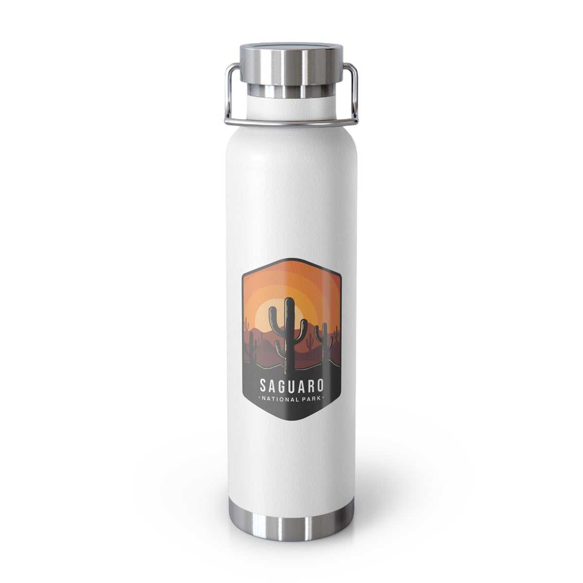 White stainless steel water bottle featuring a design of Saguaro National Park with cactus and sunset scenery.