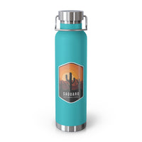 Green mint stainless steel water bottle featuring a design of Saguaro National Park with cactus and sunset scenery.