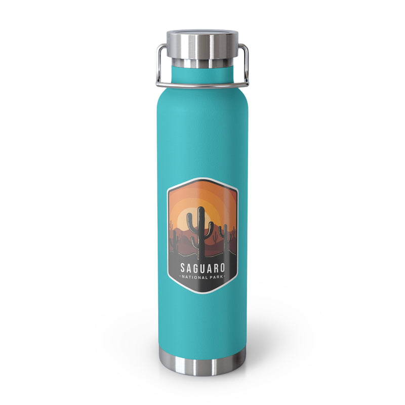 Green mint stainless steel water bottle featuring a design of Saguaro National Park with cactus and sunset scenery.