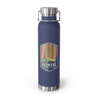 Navy stainless steel water bottle featuring a design of Redwood National Park with towering redwood trees.