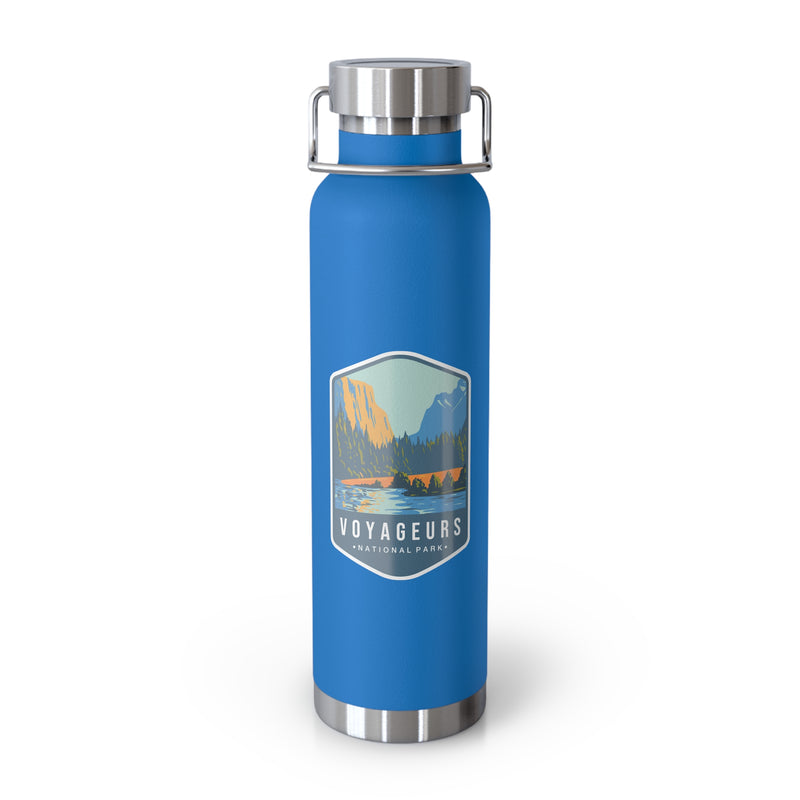 Pebble Blue stainless steel water bottle featuring a design of Voyageurs National Park with a lake and forest scenery.