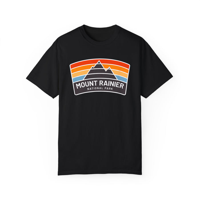 T-shirt featuring a vintage design with "Mount Rainier National Park" text and colorful stripes.