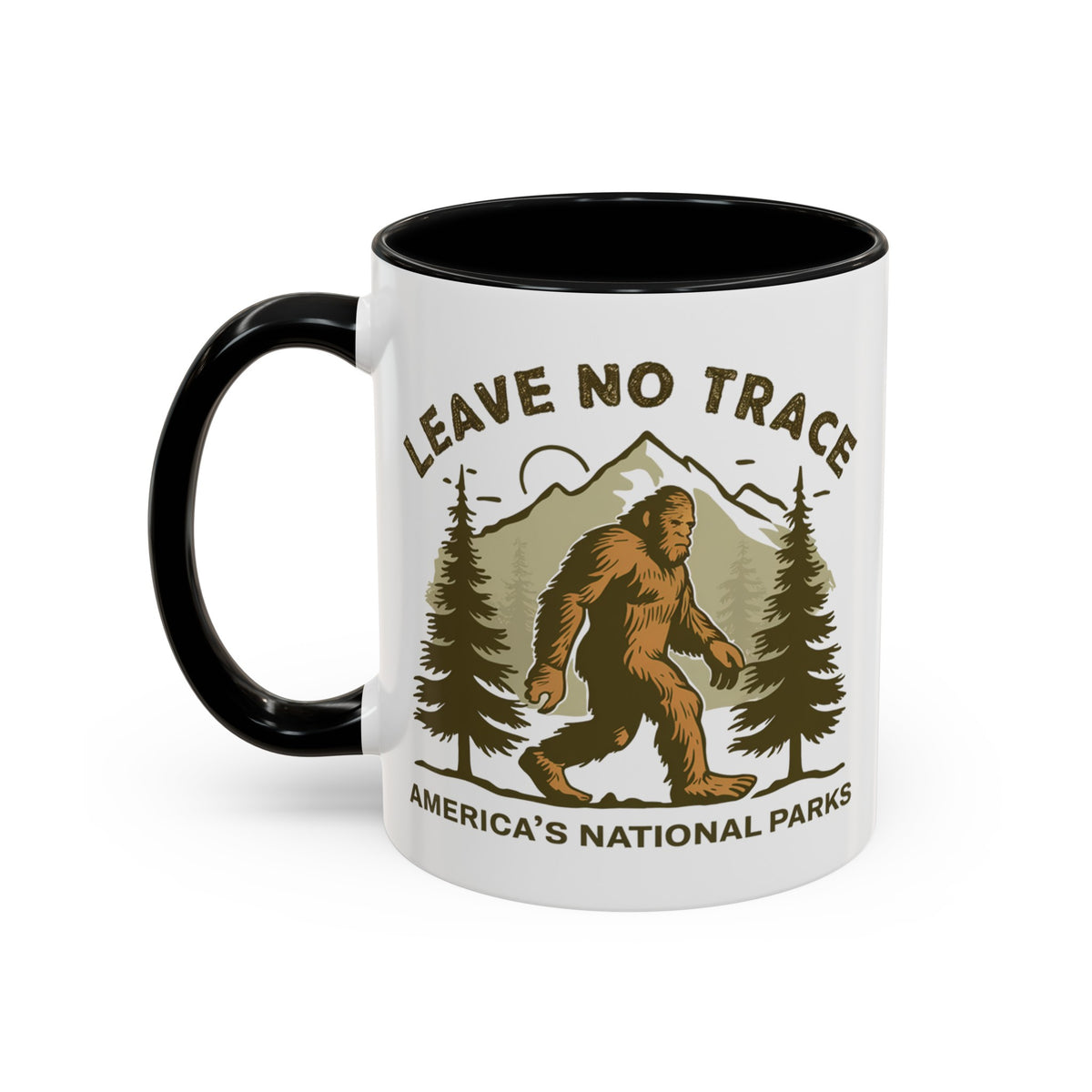 11 oz black Bigfoot souvenir mug with "Leave No Trace" text, trees, and mountains in the background, from America's National Parks.