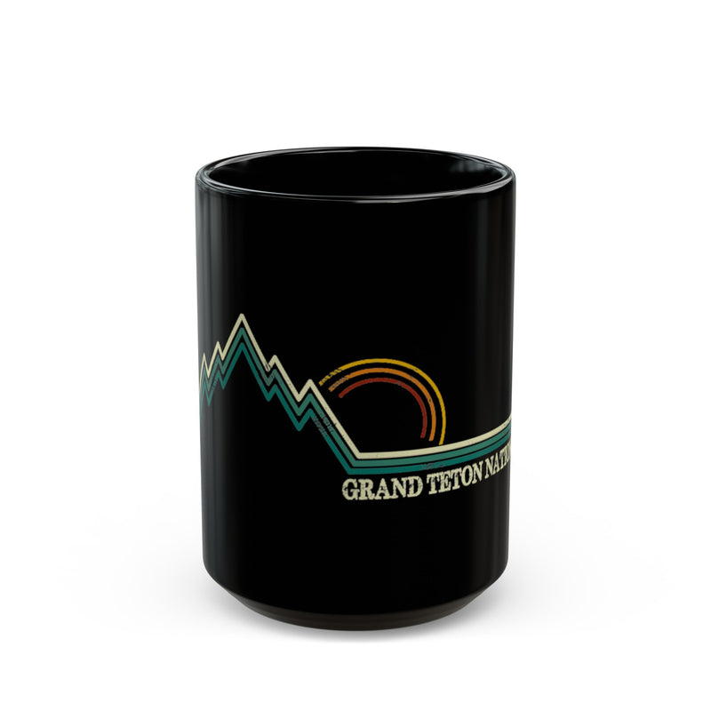 Grand Teton National Park souvenir mug featuring a mountain and sunset design.