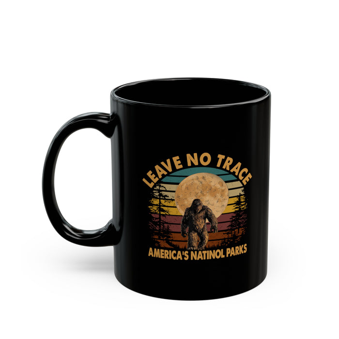 Bigfoot souvenir mug with "Leave No Trace" text and America's National Parks scene in the background.