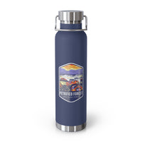 Navy stainless steel water bottle featuring a colorful design of Petrified Forest National Park with scenic landscapes.