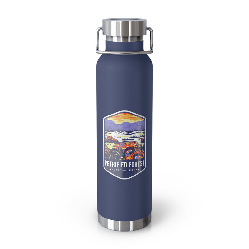 Navy stainless steel water bottle featuring a colorful design of Petrified Forest National Park with scenic landscapes.