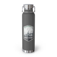 Grey stainless steel water bottle with a scenic design of Mount Rainier National Park.