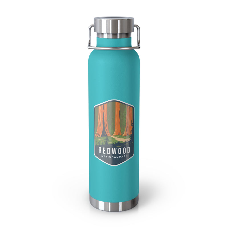 Mint green stainless steel water bottle featuring a design of Redwood National Park with towering redwood trees.