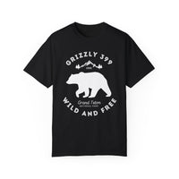 Grand Teton National Park T-shirt featuring a graphic design with Grizzly 399, mountains, and "Wild and Free" text.