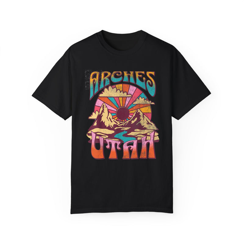 T-shirt featuring a retro scenic design of Arches National Park with a vibrant graphic.