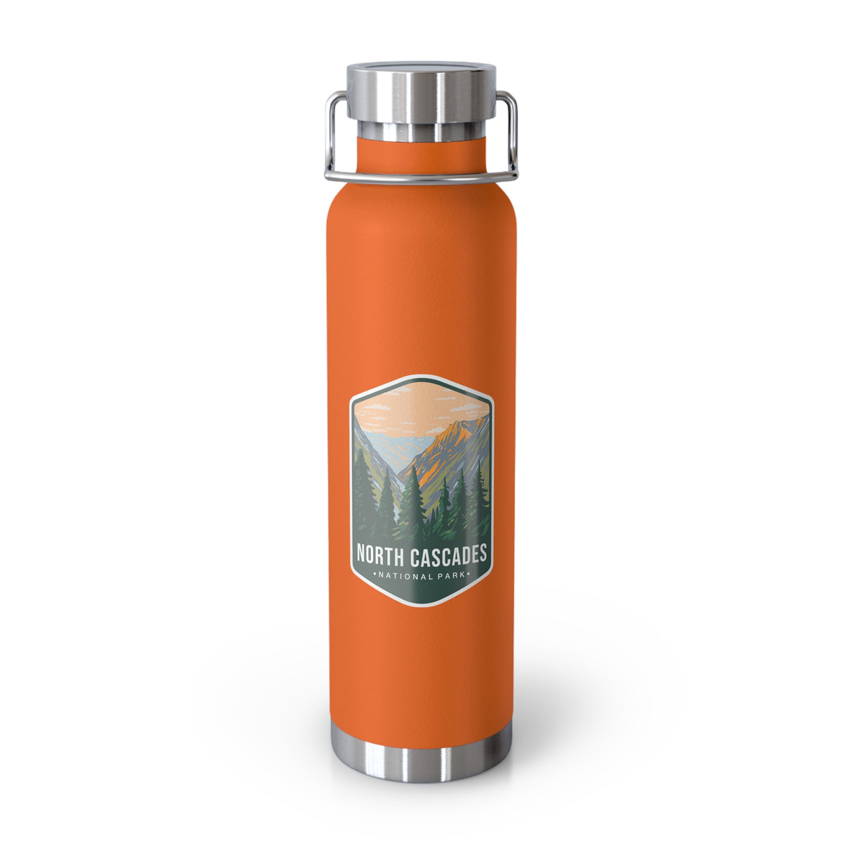 An orange double-wall stainless steel water bottle featuring a scenic design inspired by North Cascades National Park, showcasing mountains and pine trees.