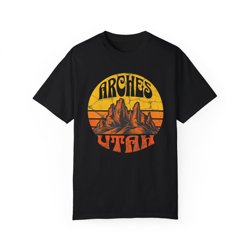 T-shirt featuring a vintage-style design with "Arches Utah" text and a scenic illustration of rock formations.