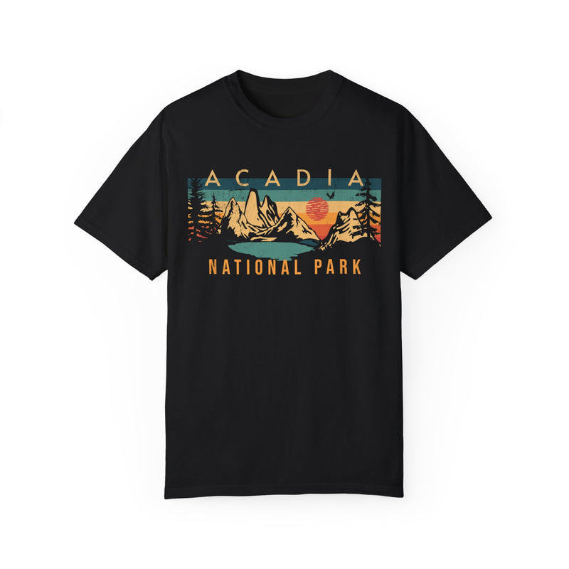 Acadia National Park T-shirt featuring a graphic design with mountains, a sun, and trees.