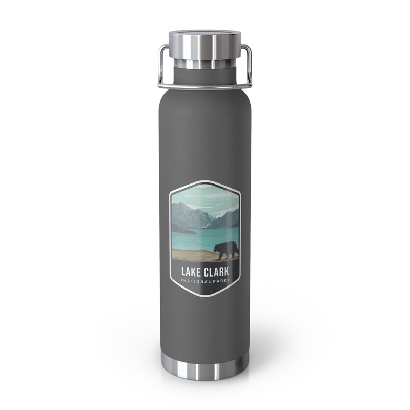 Grey stainless steel water bottle with a scenic design of Lake Clark National Park.