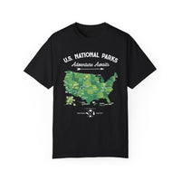 T-shirt featuring a green map of US National Parks with the text "Adventure Awaits."