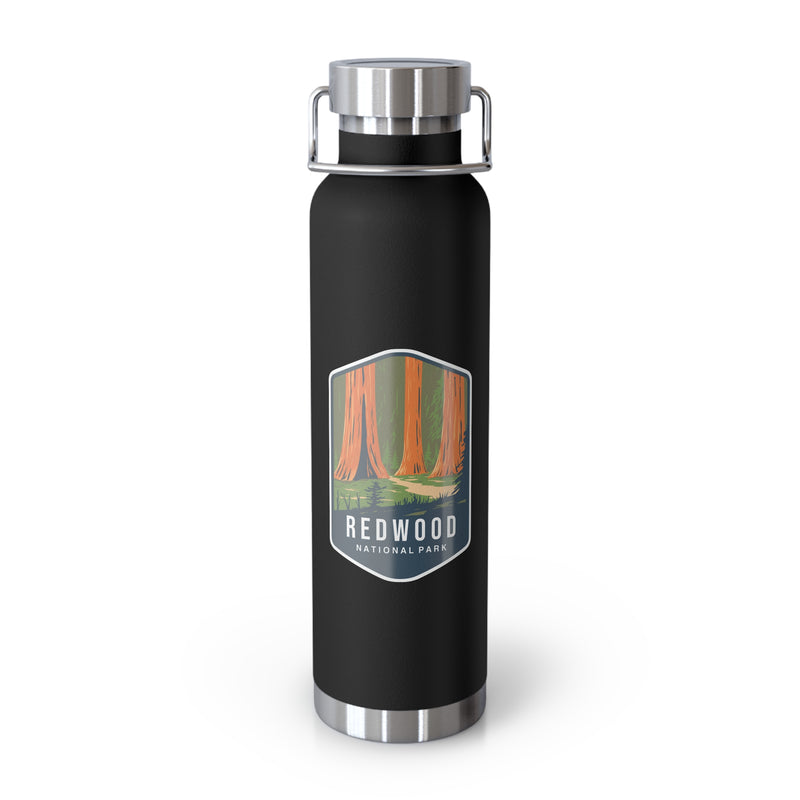 Black stainless steel water bottle featuring a design of Redwood National Park with towering redwood trees.