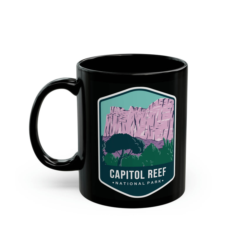 Ceramic mug featuring a scenic design with rock formations and a tree, representing Capitol Reef National Park.