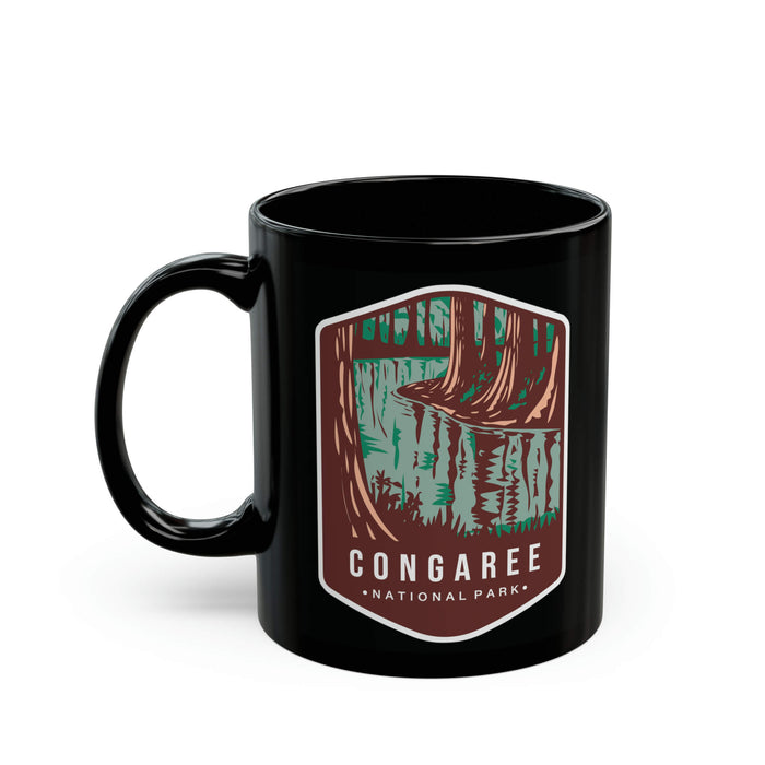 Ceramic mug featuring a scenic forest design with Congaree National Park logo.