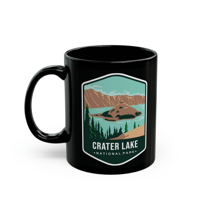 Ceramic mug featuring a scenic lake design with Crater Lake National Park logo.