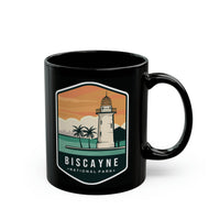 Ceramic mug featuring a lighthouse design with palm trees, representing Biscayne National Park.